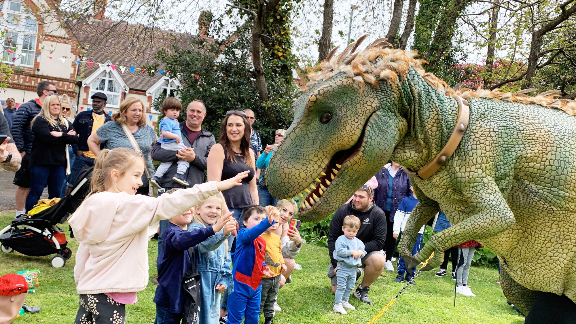 Children meeting the friendly dinosaurs